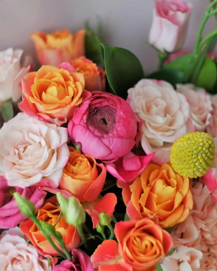 A bouquet of pink and orange roses for a birthday
