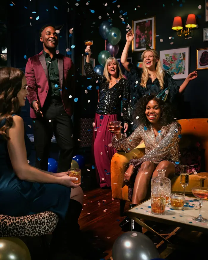 A group of friends celebrating at a birthday surprise party